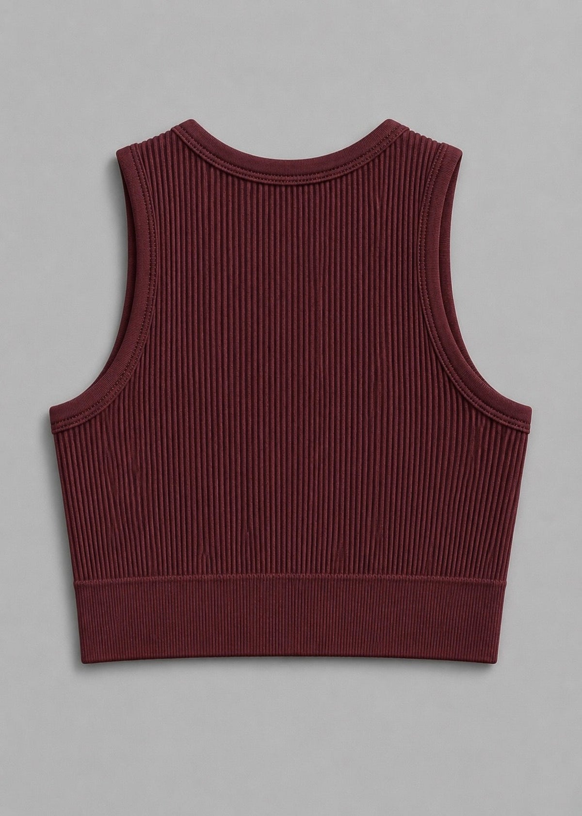 A sleeveless ribbed knit crop top in a deep burgundy color, shown from the back on a neutral gray background.