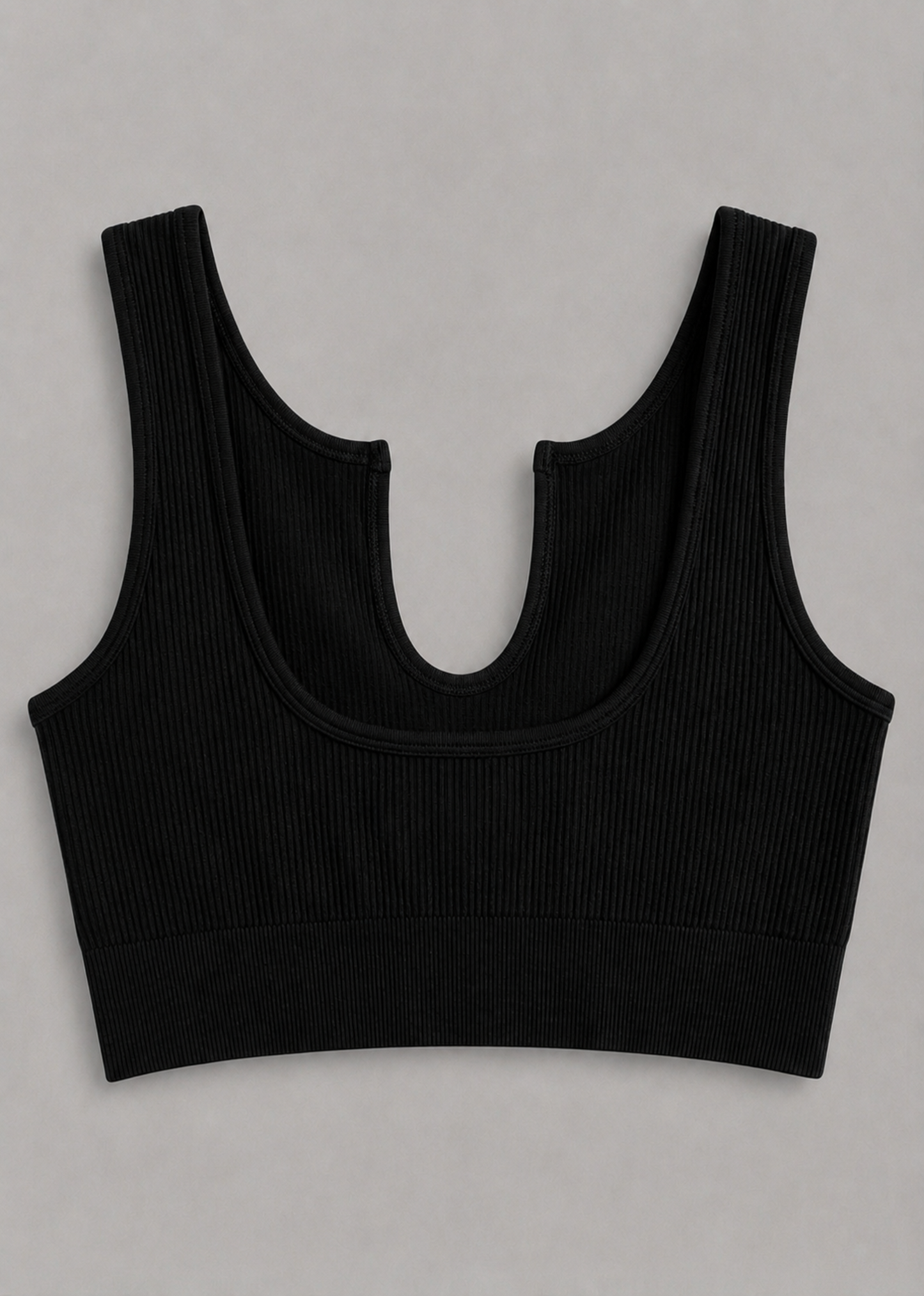 A black ribbed knit scoop neck tank top with wide shoulder straps, displayed flat against a neutral gray background.
