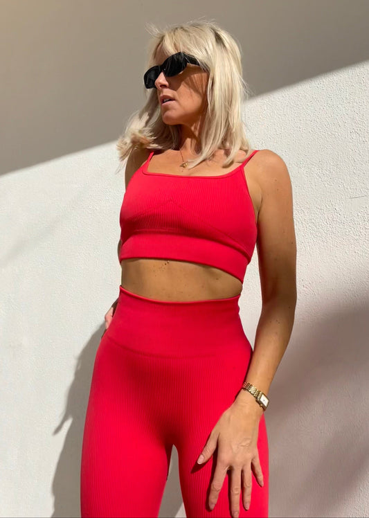 Model wearing Amber Maxwell Marina crimson crop top with adjustable straps.