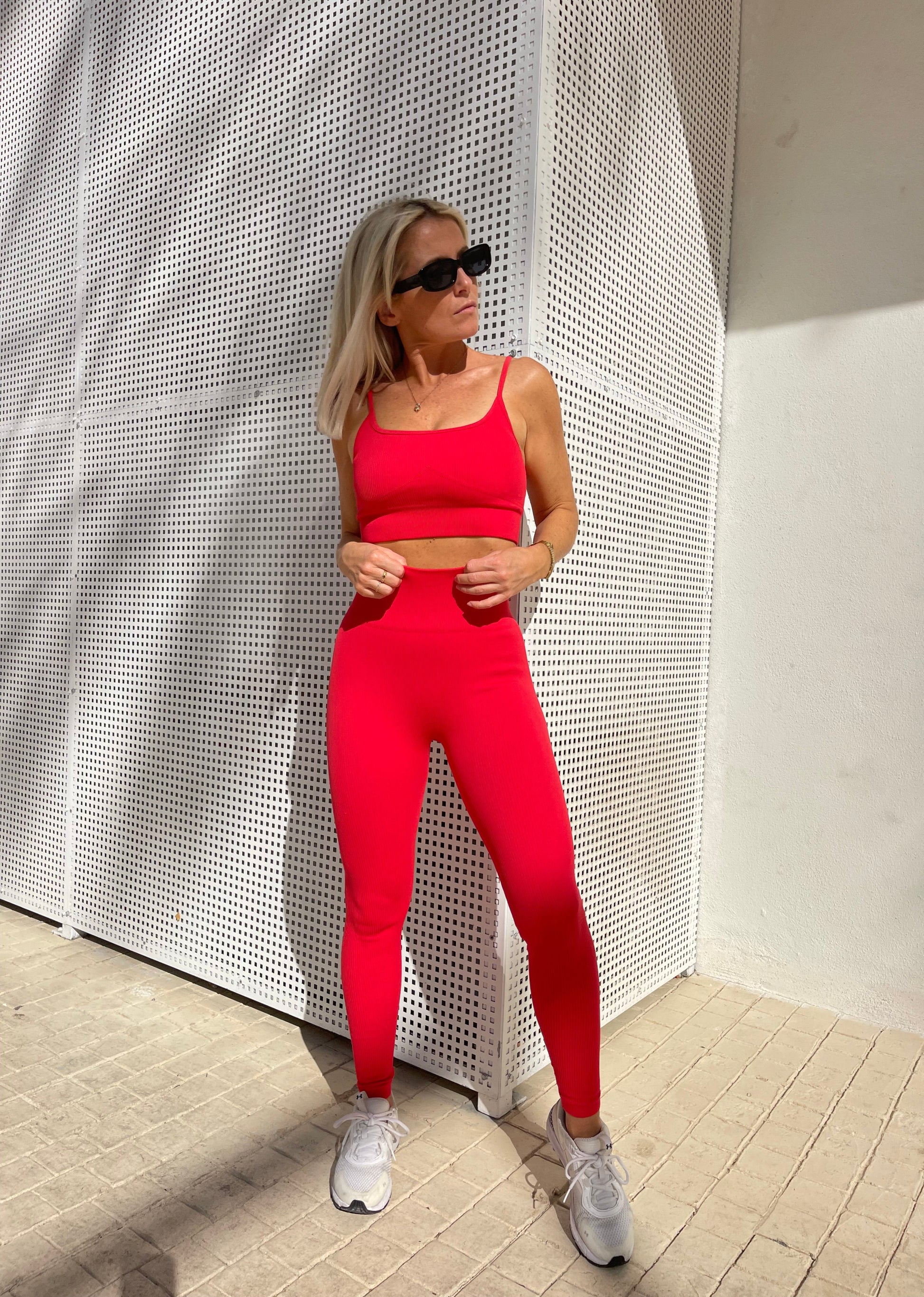 Close-up of Amber Maxwell Marina crimson crop top and Marina leggings worn by model in Ibiza out and about. 